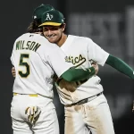 Los Atleticos remontan en la sexta y frenan a los Rockies con cuatro seguidas